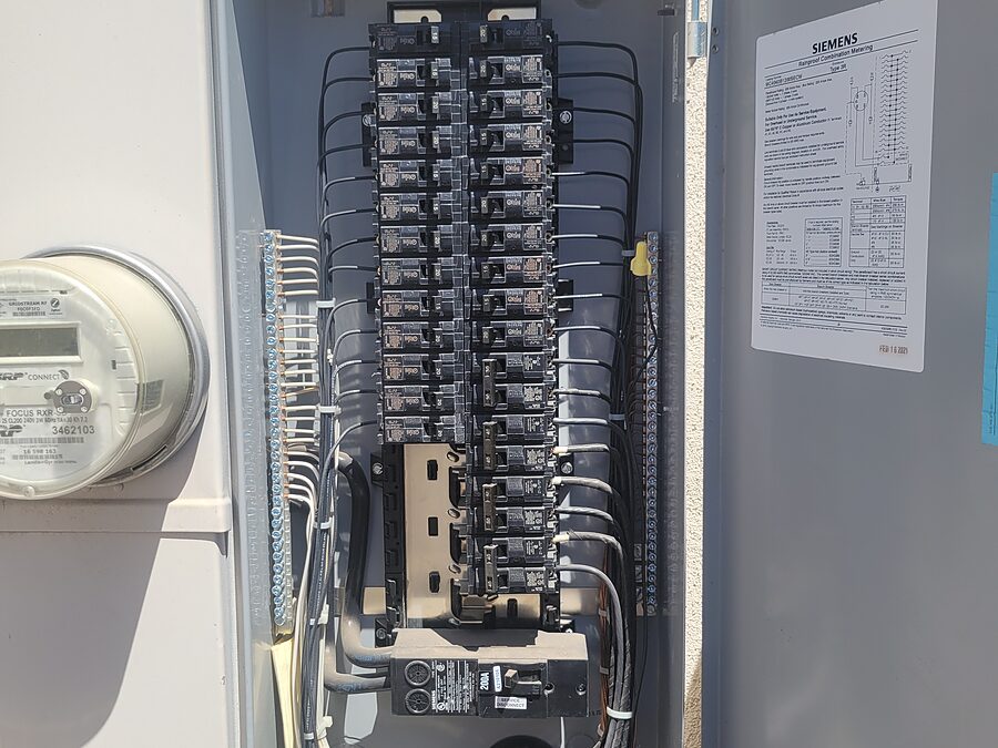 Electrical panel and breaker checked during AC burning smell diagnostics