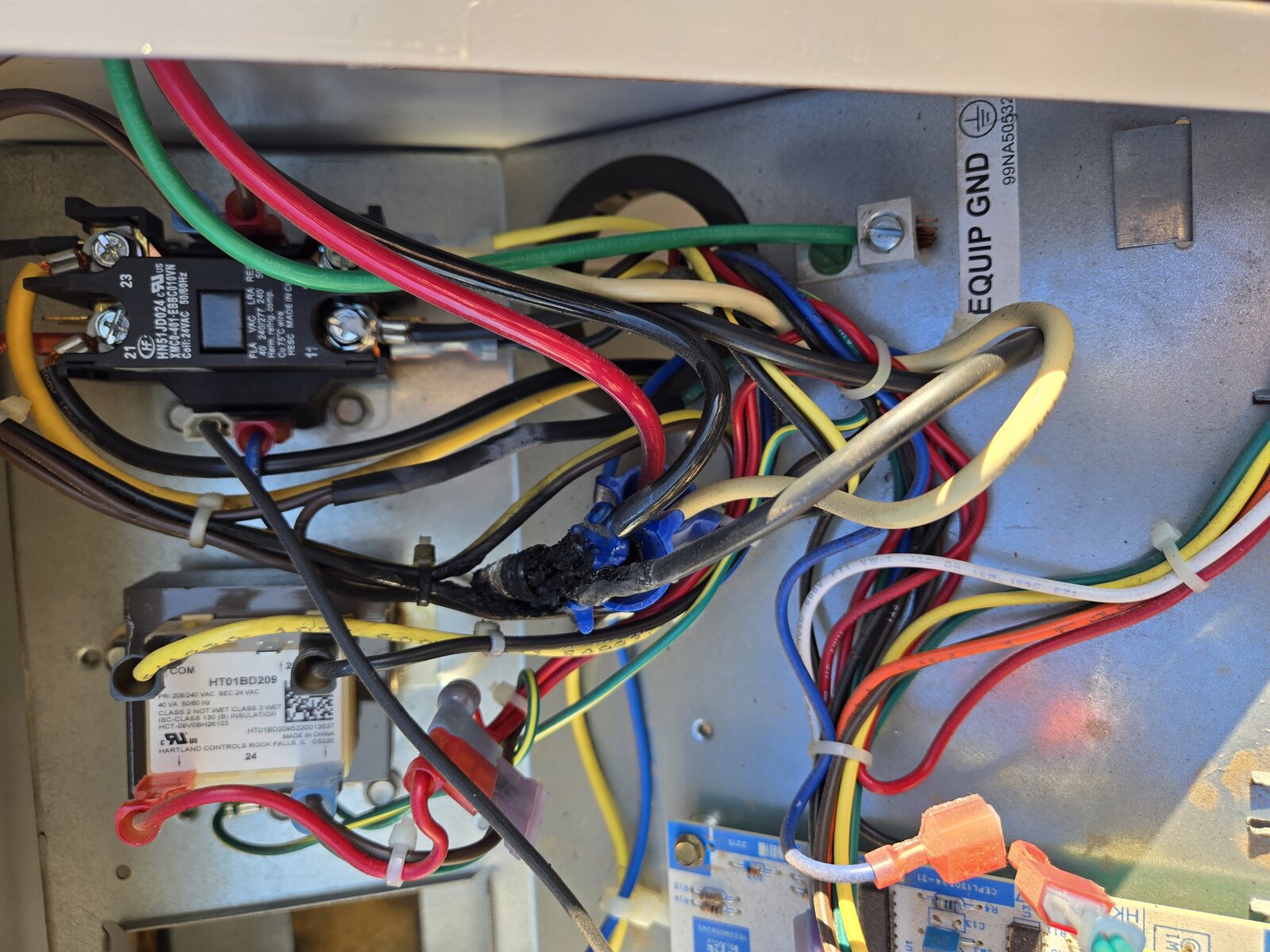 Air conditioner electrical panel wiring and contactor during maintenance check