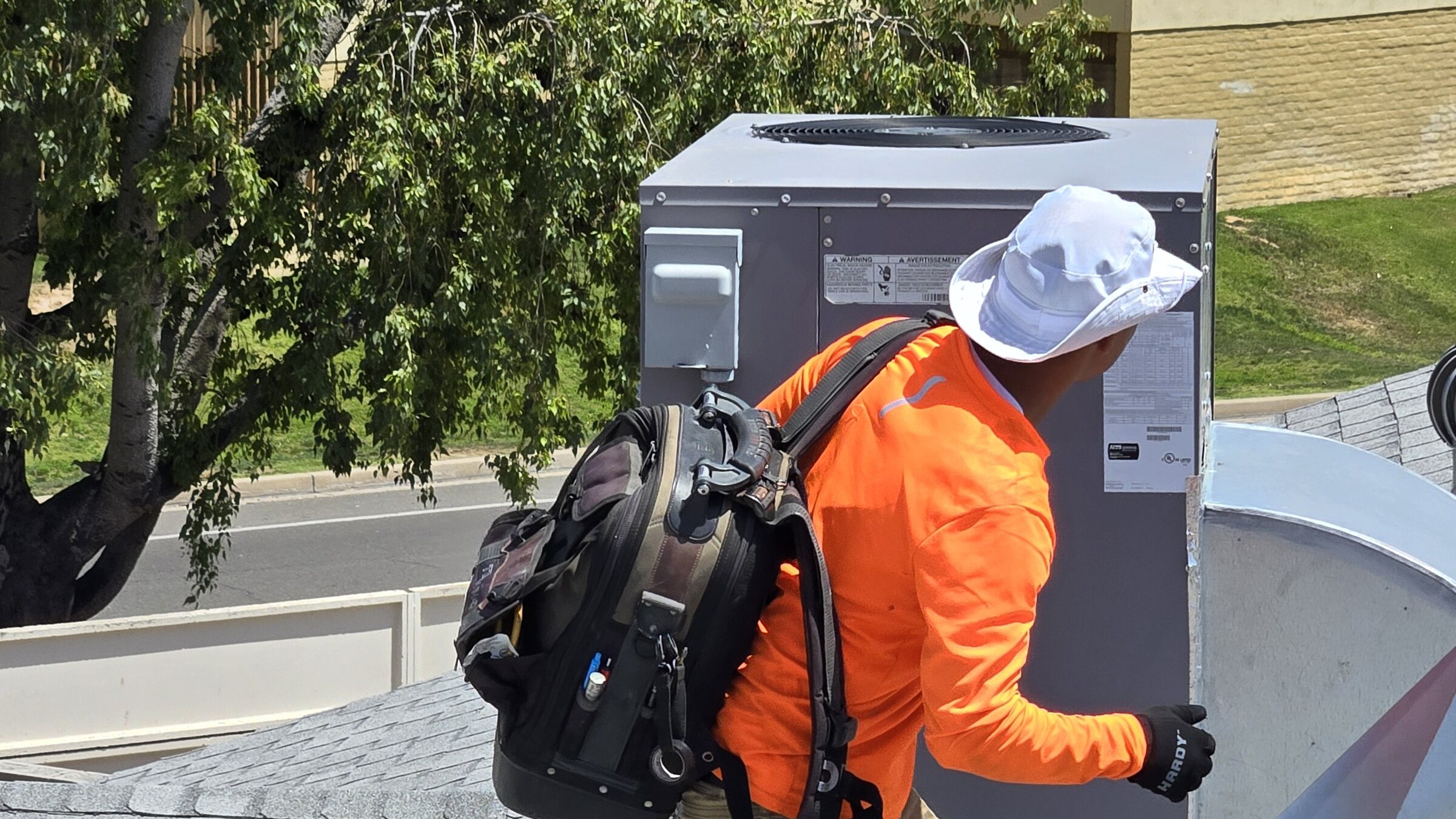 Rooftop package unit during residential AC maintenance