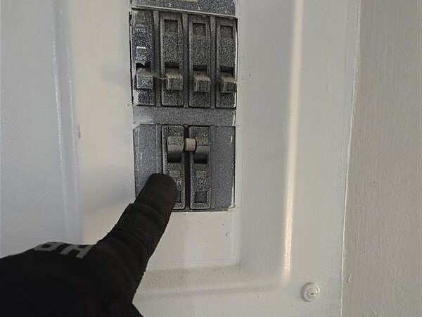 Small breaker checked before an AC service call for a burning smell