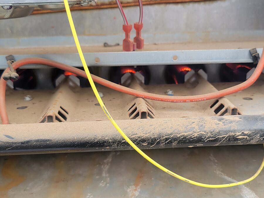 HVAC burner compartment checked when comparing a light burning dust smell with an electrical burning smell