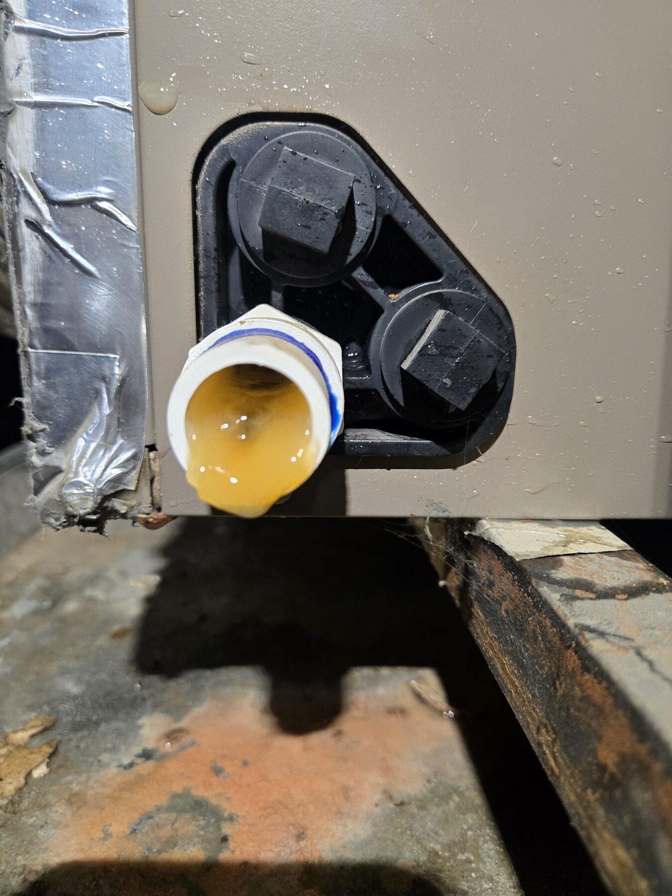 HVAC condensate drain port with cap removed