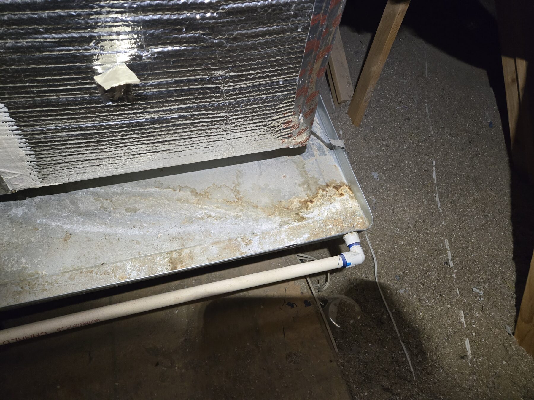 Drain pan and condensate drain line checked for AC water safety