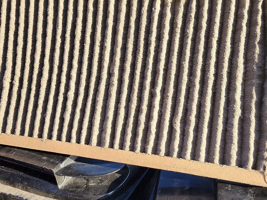 Dirty air filter checked during blower motor stress and airflow diagnostics