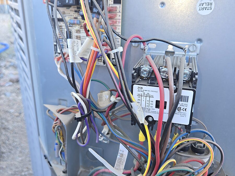 Open condenser electrical compartment checked for short cycling causes