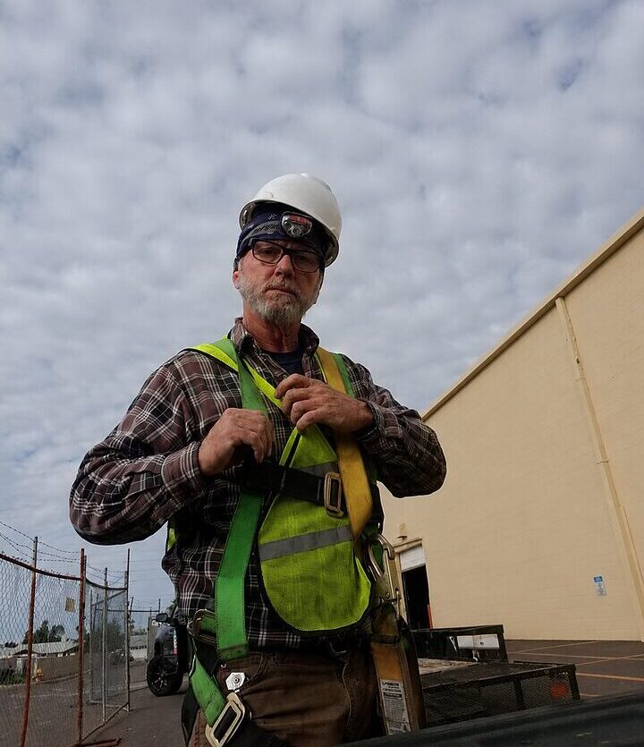 Leon Huff wearing rooftop safety gear for CTS Air Conditioning service work