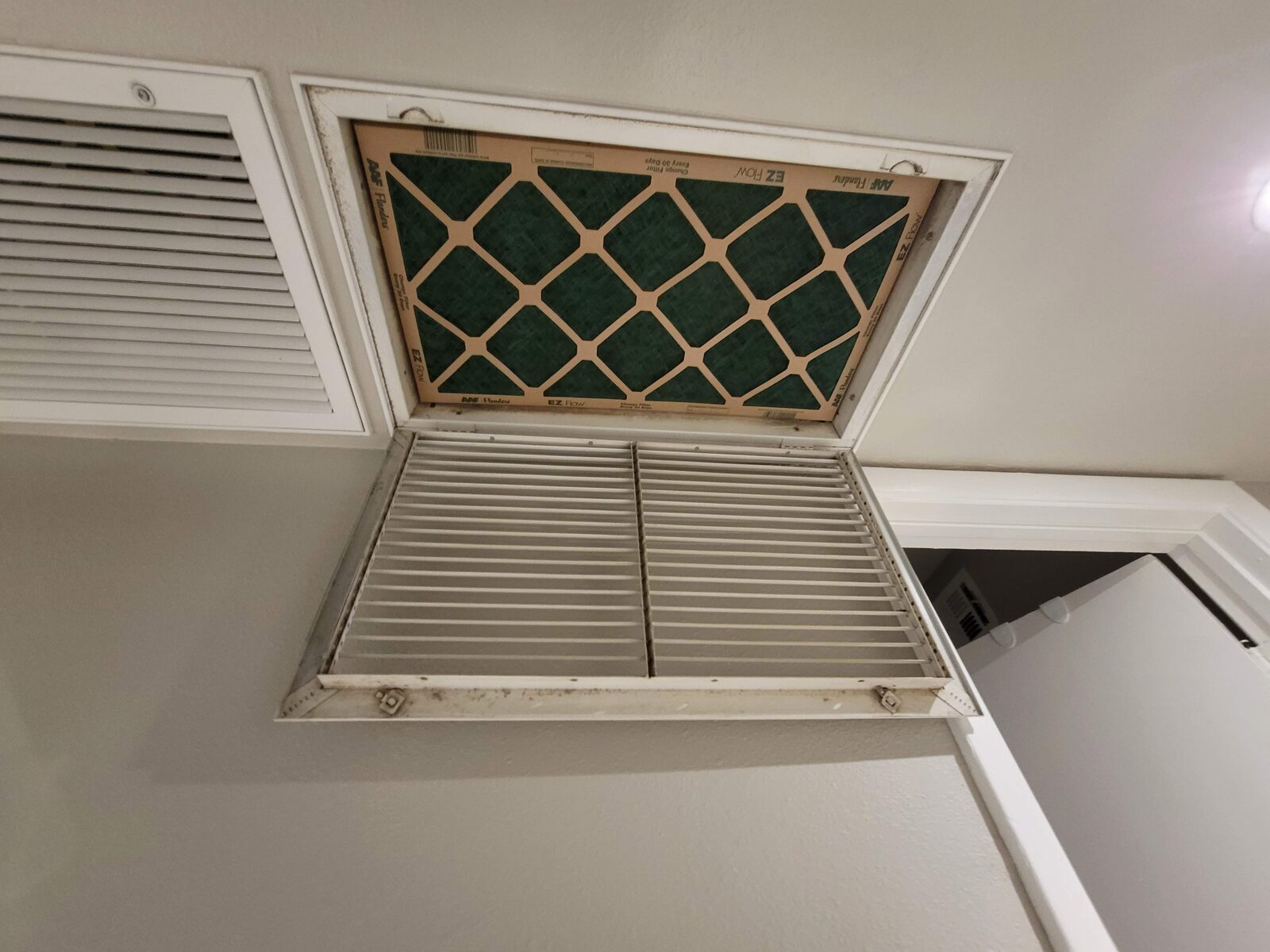 Return air filter grille checked for airflow and filter fit