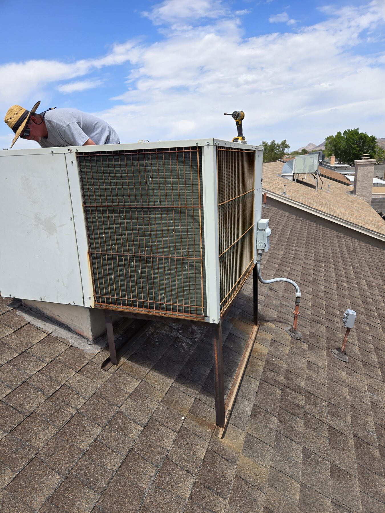 Rooftop package unit checked for heating and cooling service
