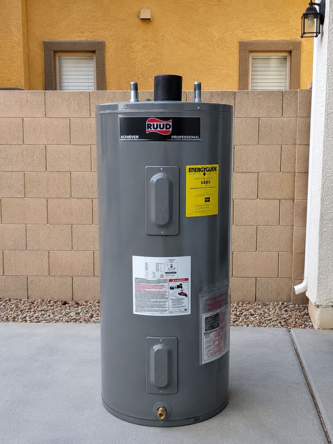 Ruud tank water heater installed outdoors in the Phoenix area