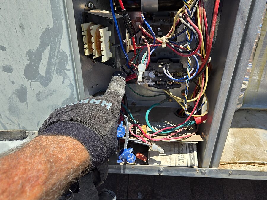 Outdoor unit and breaker area checked before forcing a noisy AC to keep running